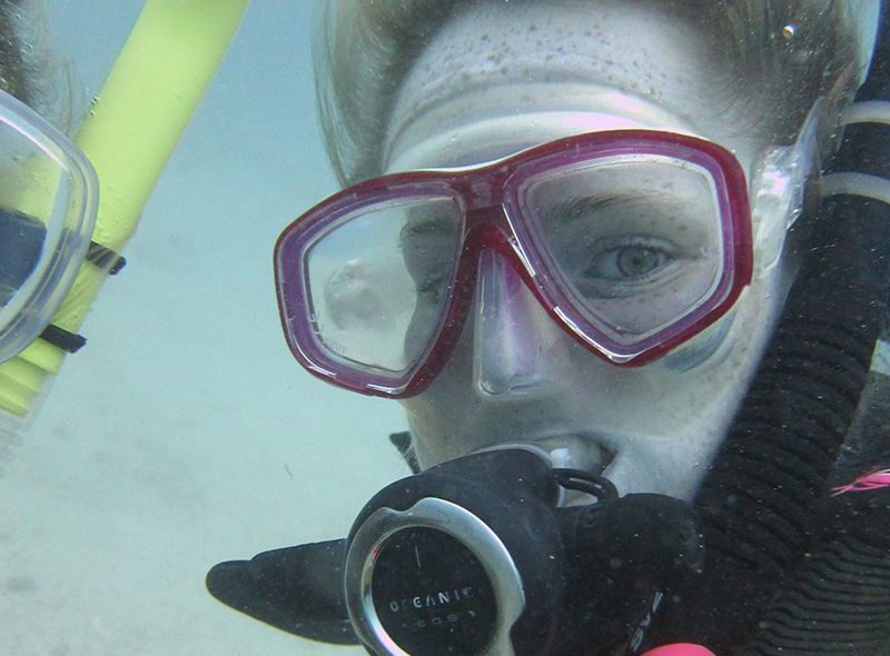 Teen scuba diving on underwater adventure camp