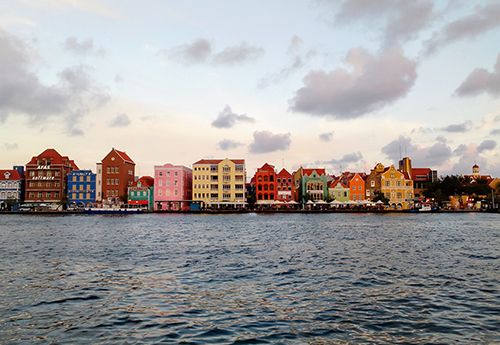 Colourful buildings along dock in Curacao seen on Broadreach marine biology summer programs