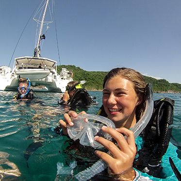 Teens after in ocean after scuba dive on advanced teen scuba program