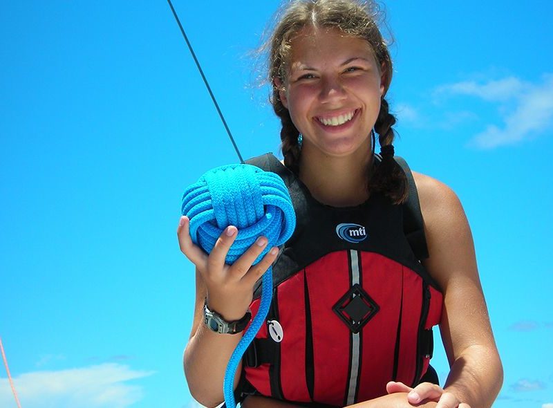 summer sailing camp student learning knots