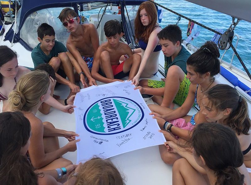 summer sailing camp teens with Broadreach flag