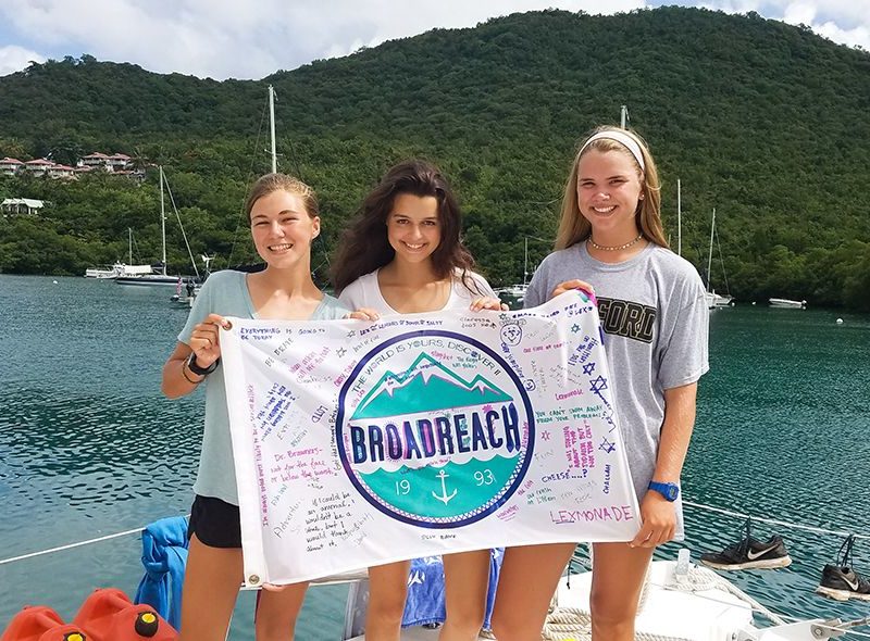 Teens with Broadreach flag on Caribbean summer camp