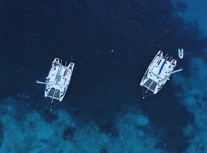 Two Broadreach boats anchored in windward islands on Broadreach scuba adventure