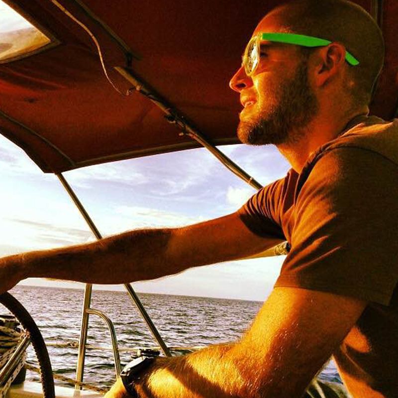 Study abroad coordinator Patrick Brydon on a boat