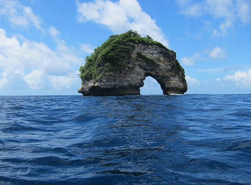Small rock island dive site on advanced Bali scuba diving camp