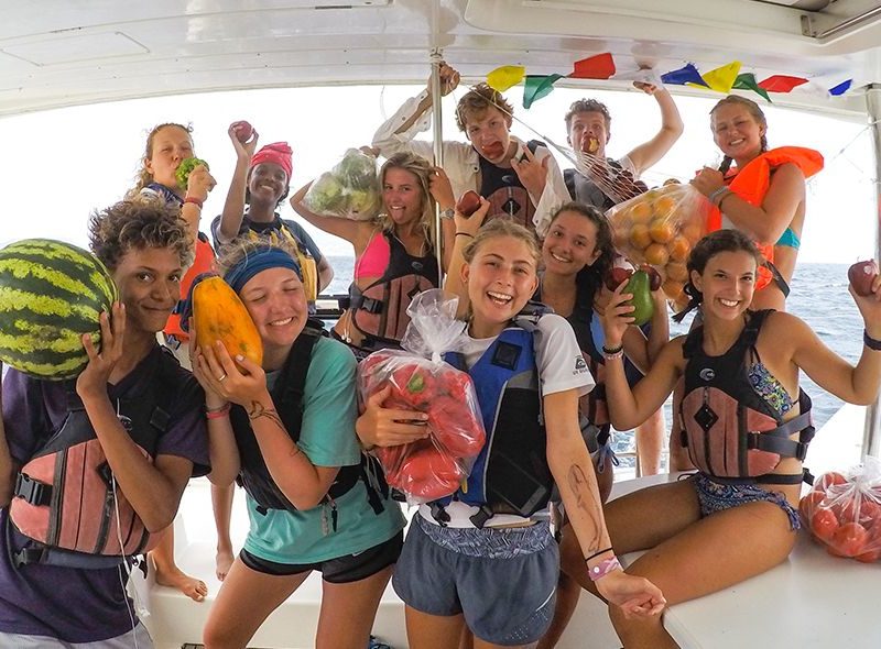 Teens with tropical fruit on Broadreach marine biology
