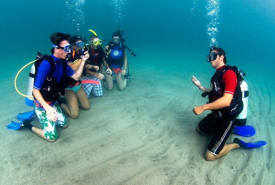 Instructor trainee learning to teach scuba skills on diving internships Caribbean