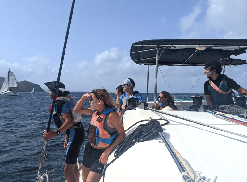 Teens sailing catamaran at advanced scuba and sailing camp