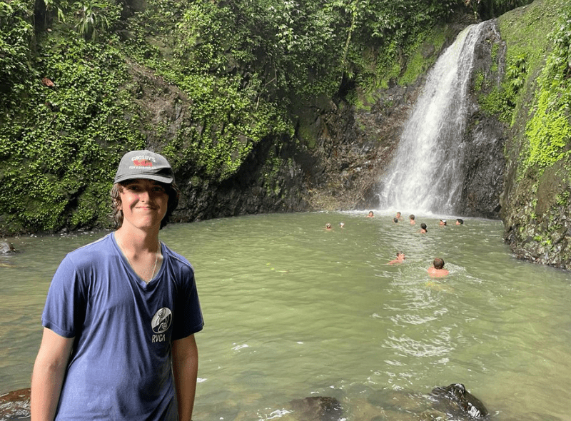 Middle school students hike to island waterfall on advanced scuba trip