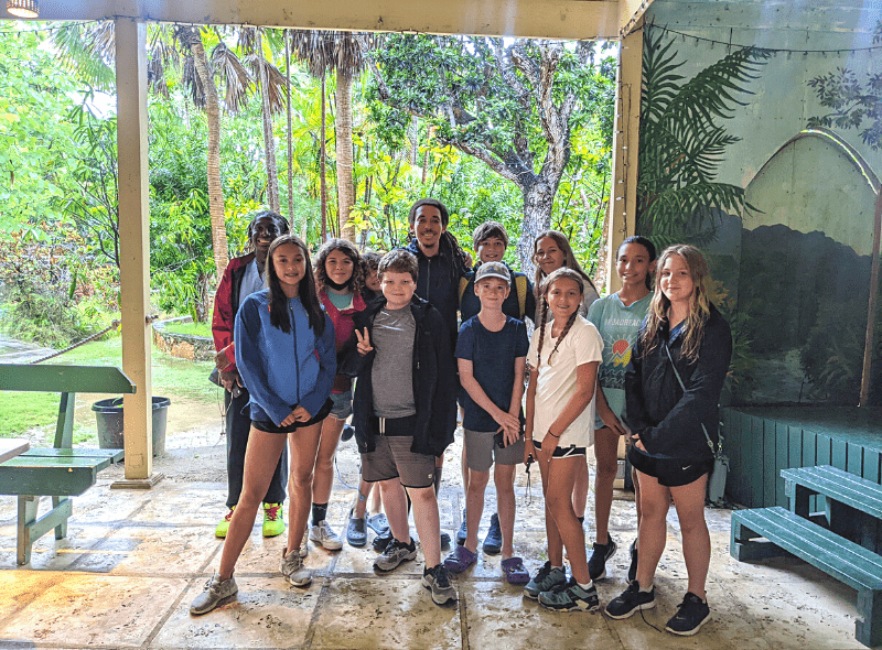 Group of young teens at animal rescue in Bahamas at summer camp