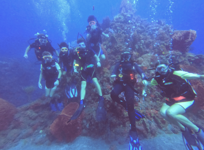 Group of middle school students scuba diving at advanced scuba trip