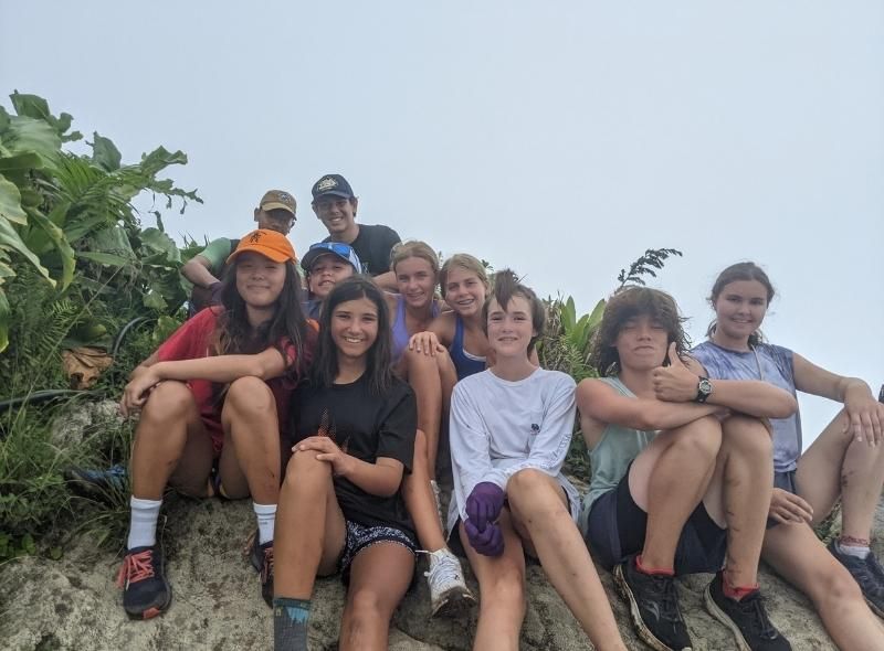 Young teens hike and explore island on marine biology summer trip