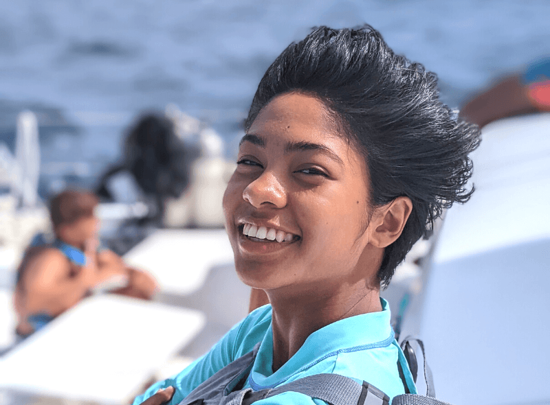 Portrait of middle school student on catamaran for scuba and sailing trip