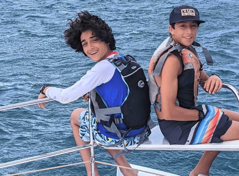 Middle school students at bow of catamaran during scuba and sailing program