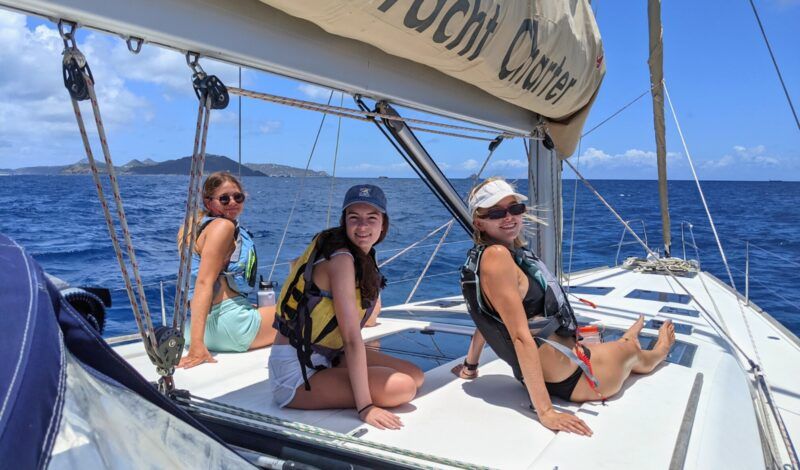 High school beginner sailing students on monohull in Caribbean