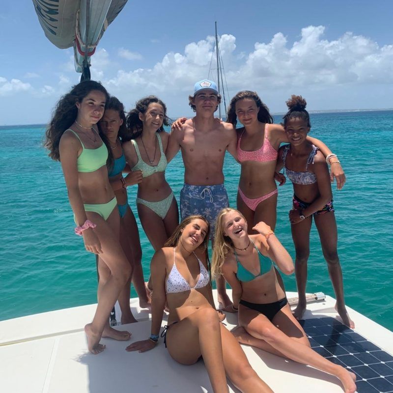 Group of teens on catamaran for summer sailing program