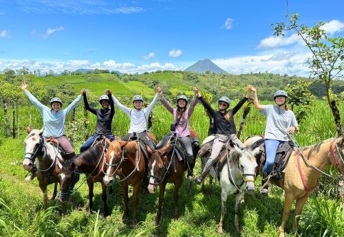 group of high school students on veterinary medicine program ride on horseback in Costa Rica