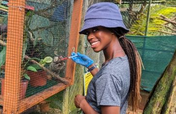 high school student cares for marmoset in Costa Rica on veterinary medicine program