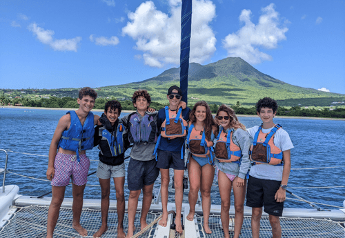 Group of Advanced Scuba middle school students on catamaran at scuba camp