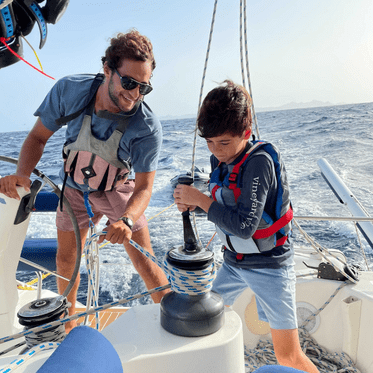 Middle school advanced scuba trip student with instructor learning to sail