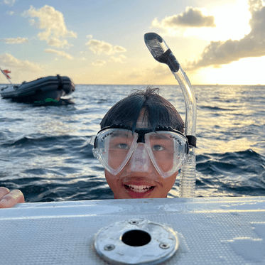Middle school boy wears snorkel mask on dive and sail program