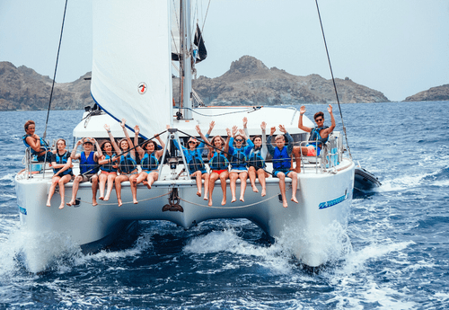 group of teens on catamaran during Caribbean dive and sail program