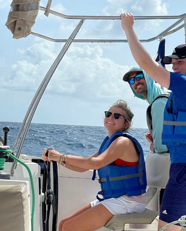 high school teens sailing catamaran on summer program