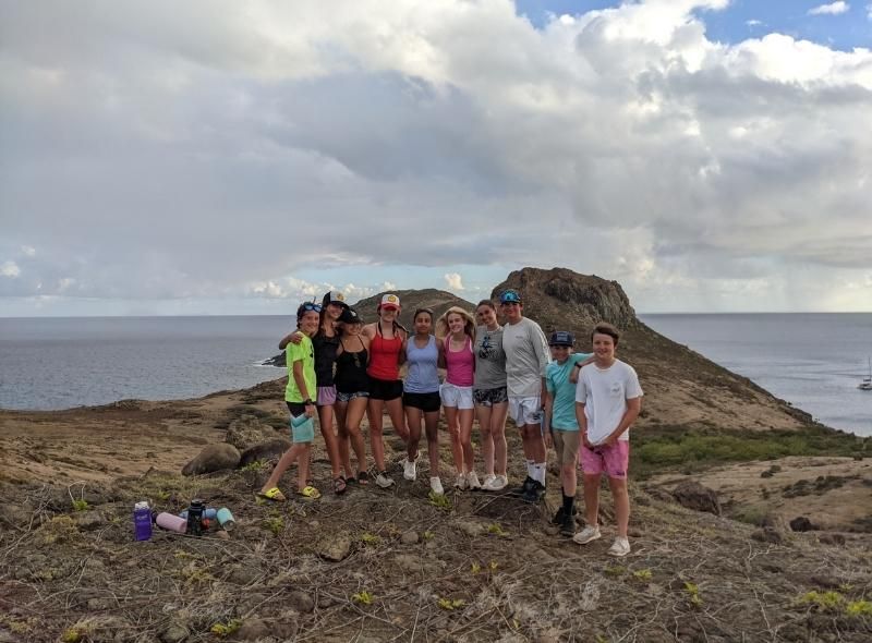 Group of middle school students explore Caribbean island during summer dive and sail program