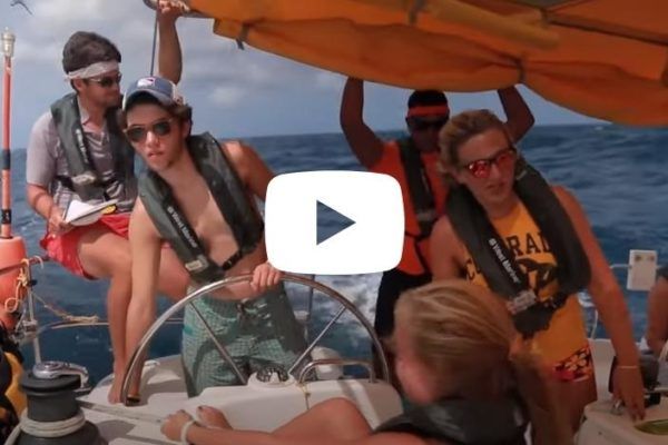 Teens sail a monohull in the Caribbean on a Broadreach sailing camp