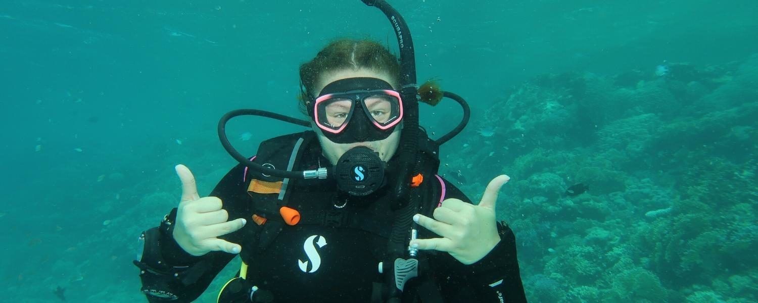 teen diving on marine biology summer camp