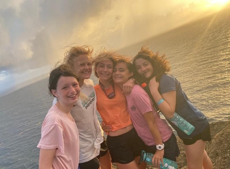 Middle school students hike at dawn on summer program abroad for middle school students
