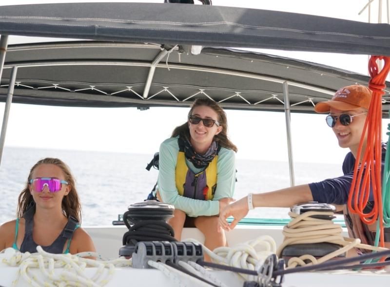 sailing instructor abroad with two high school sailing students