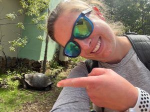 Veterinarian and Broadreach instructor with Galapagos tortoise on animal biology adventure