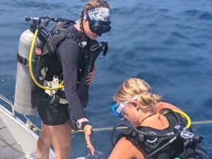 PADI divemaster assists student on Broadreach trip