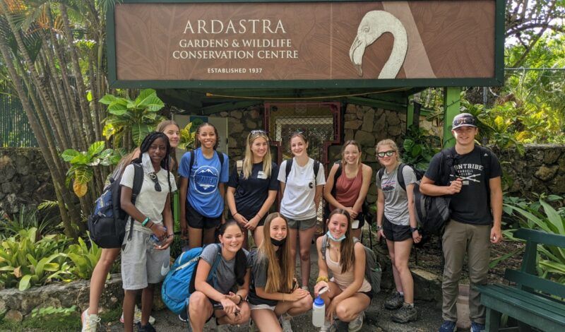 Group of high school students at animal conservation center in Bahamas during summer animal science trip