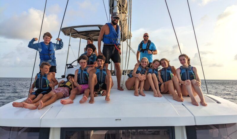 Middle school students on catamaran in Caribbean on summer program