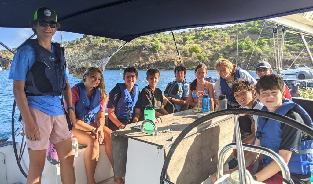 high school students on sailboat for liveaboard introductory sailing program