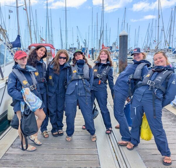 students pose on dock before whale watching on Azores whale and dolphin marine biology program
