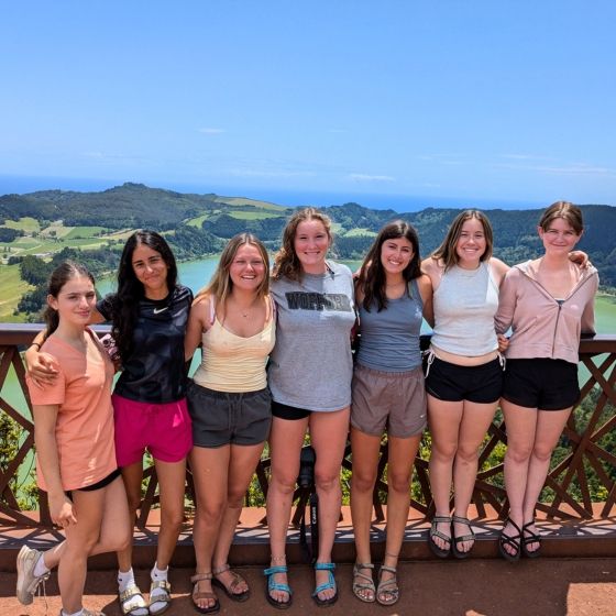 high school students with mountains and ocean in backdrop on whale summer program