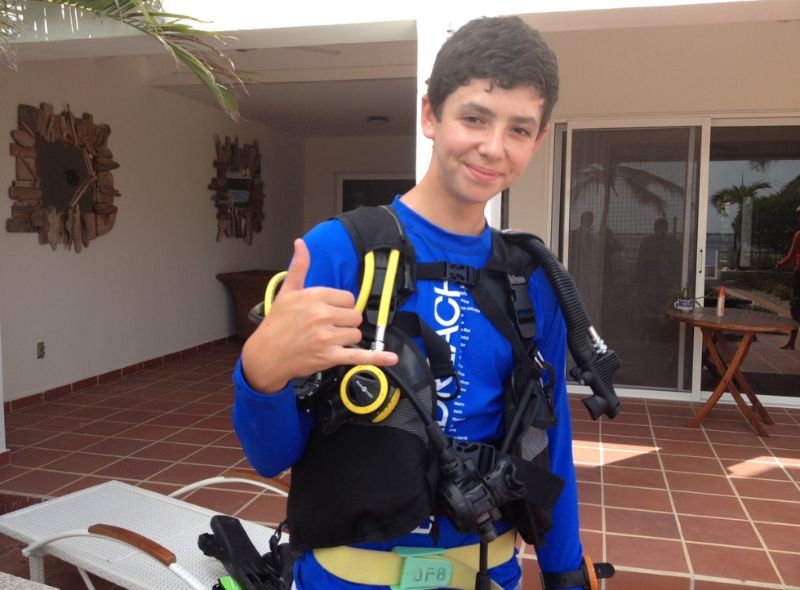 middle school student in scuba gear on introductory scuba program