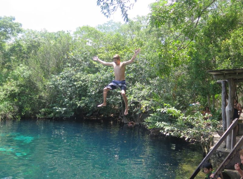 High school student jumps in cenote on ocean conservation summer program in Mexico