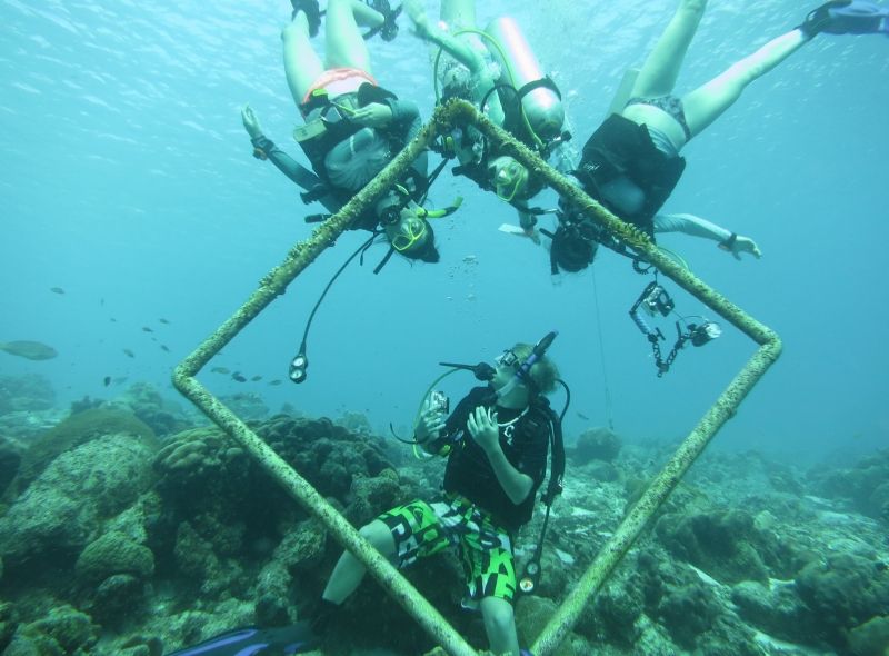 Middle school divers work on buoyancy during scuba summer program