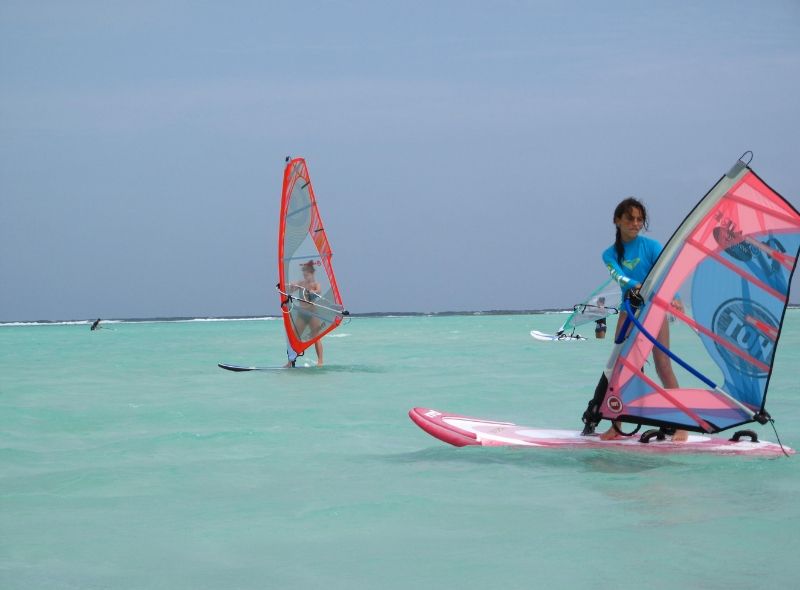 Middle school student windsurfs in Bonaire on summer scuba program