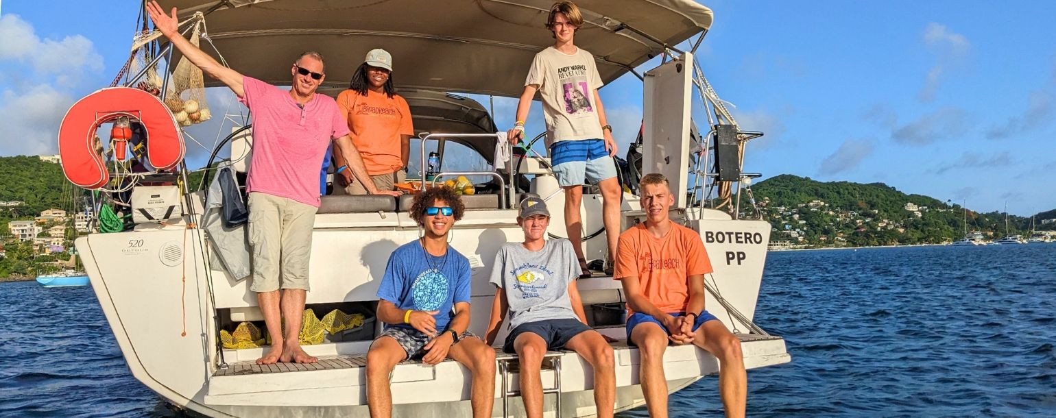 High school students on sailboat in the Caribbean on summer sailing program