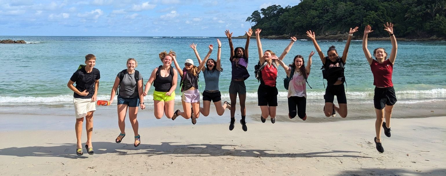 Teens jump on Costa Rica beach during animal science camp