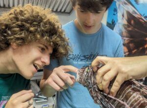 Students learning about lionfish removal and conservation in Curaçao