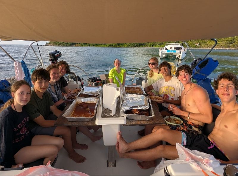 high school students on sailboat in Caribbean on summer sailing program