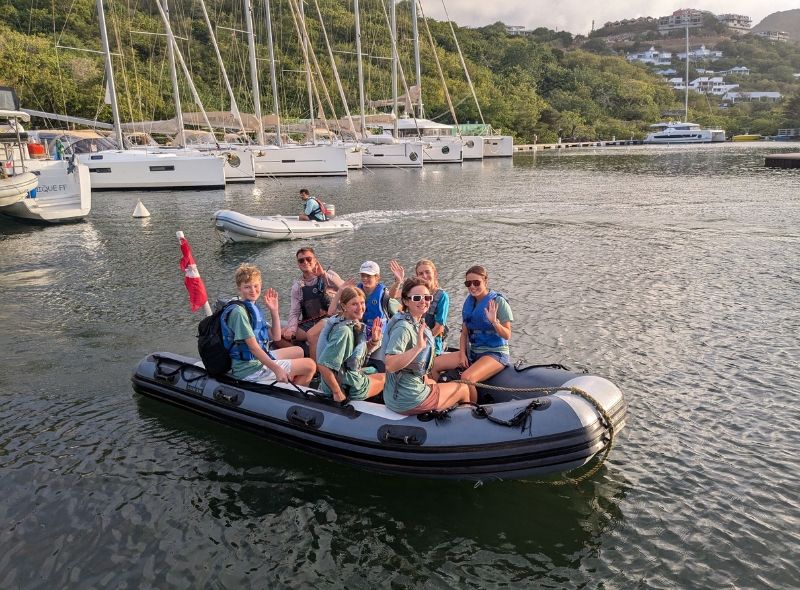group of middle school students on dingy with instructor on Caribbean scuba and sailing camp