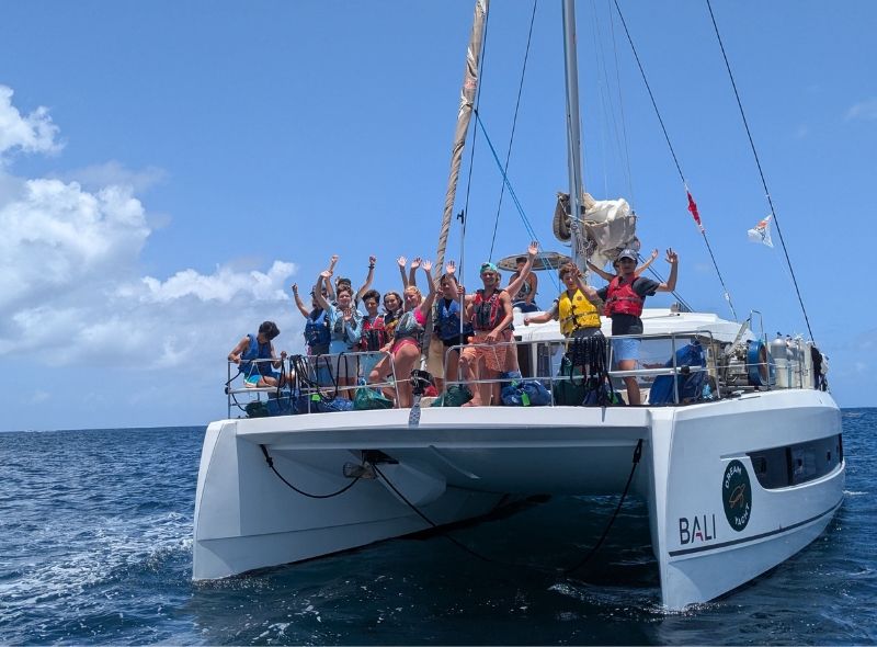 group of middle school students on a catamaran on Caribbean summer scuba camp