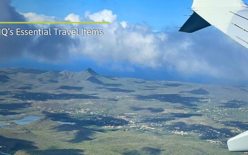 Aerial view of island with wing of airplane during trip